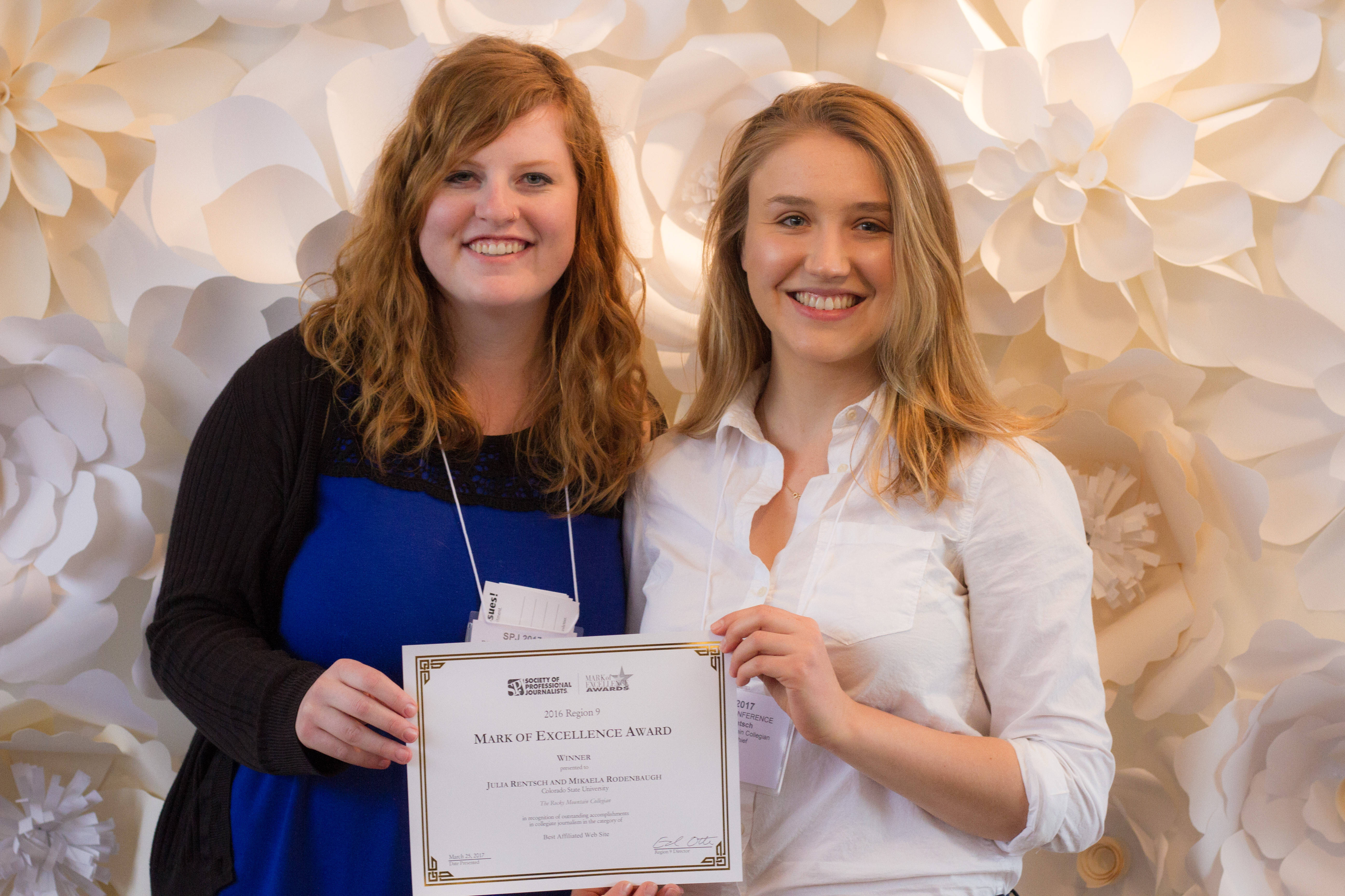 Julia Rentsch (right), editor in chief, and Mikaela Rodenbaugh, managing editor, receive a 2016 Mark of Excellence Award for "best affiliated website" in Region 9 on behalf of the Rocky Mountain Collegian staff in Salt Lake City, Utah, in April 2017.